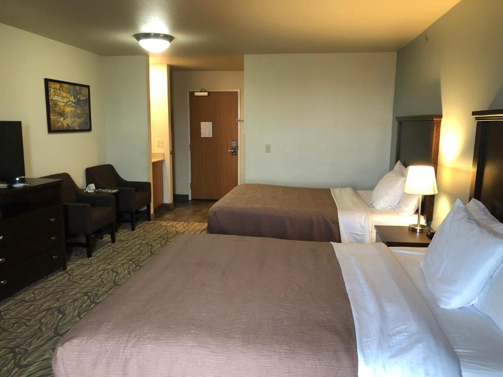 Postel nebo postele na pokoji v ubytování Aptel Studio Hotel