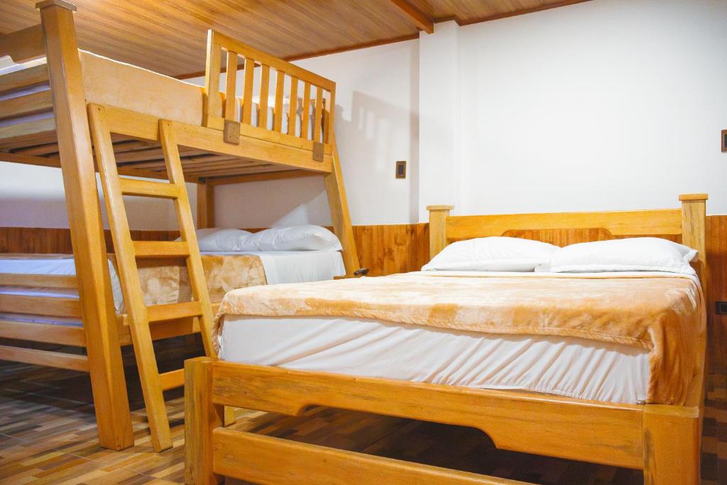 Postel nebo postele na pokoji v ubytování Riverside La Masía Ecohotel