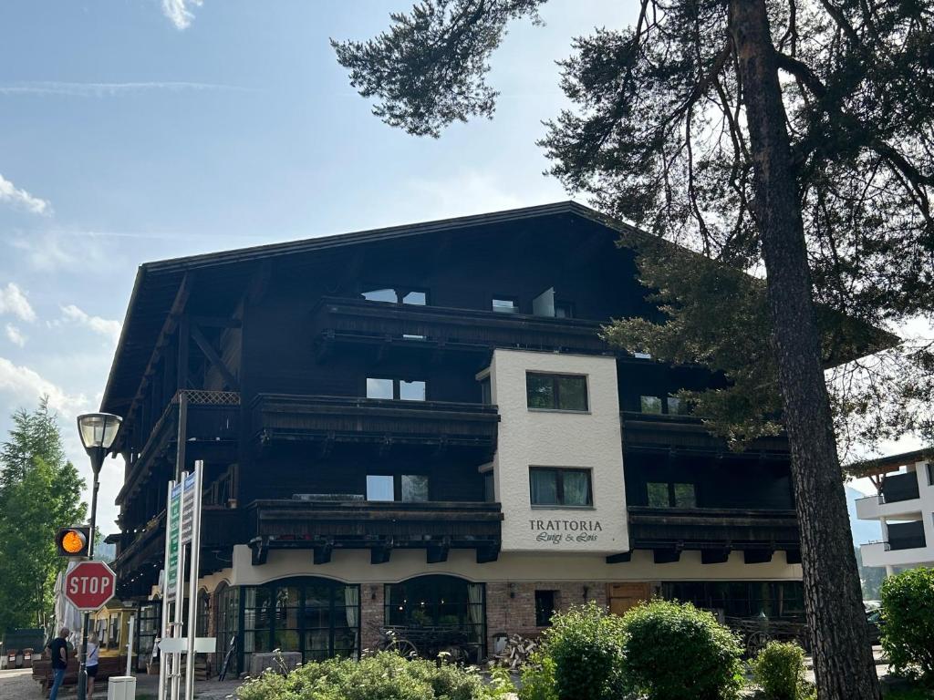 a black and white building with a stop sign at Andys Secret Apartment in Leutasch