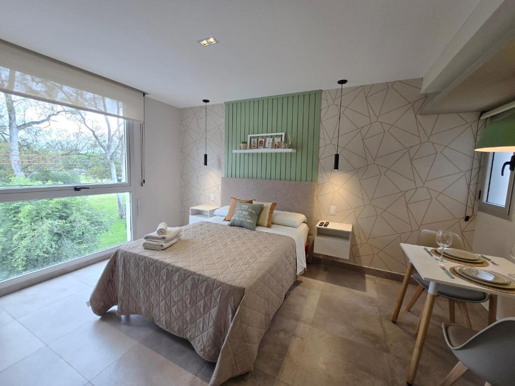 Postel nebo postele na pokoji v ubytování Hermoso dpto con vista al parque