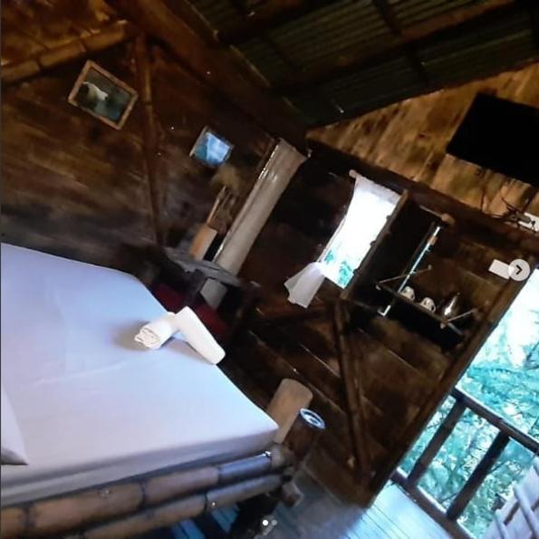 Postel nebo postele na pokoji v ubytování Cabañas Rusticas El Viejo Tambo