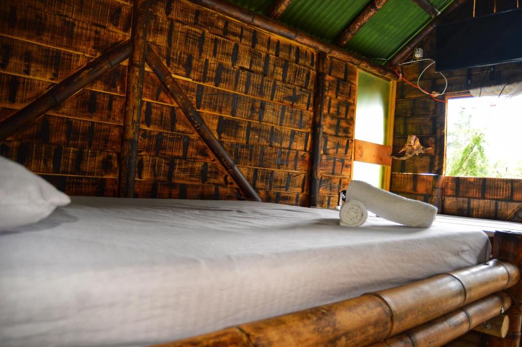Postel nebo postele na pokoji v ubytování Cabañas Rusticas El Viejo Tambo