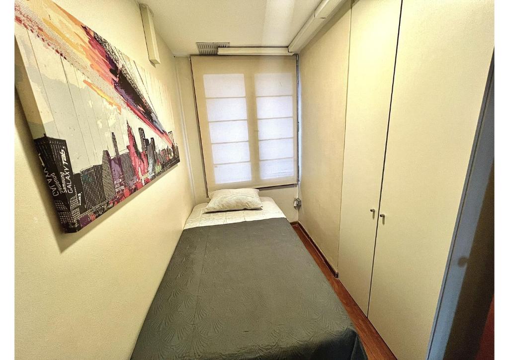 Voodi või voodid majutusasutuse Hostel La Moneda toas