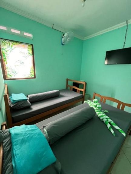 Postel nebo postele na pokoji v ubytování Bronk House 1 Malioboro