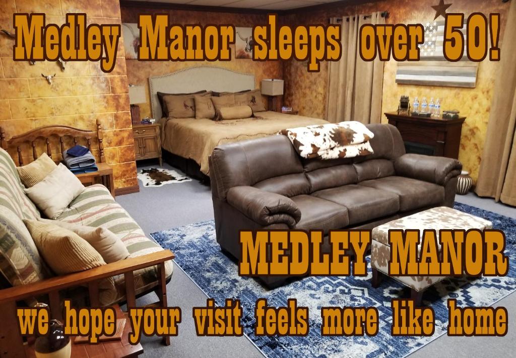 a living room with a couch and a bed at Medley Manor in Creve Coeur