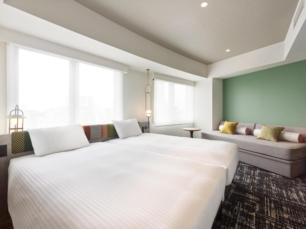 Postel nebo postele na pokoji v ubytování Mitsui Garden Hotel Ueno