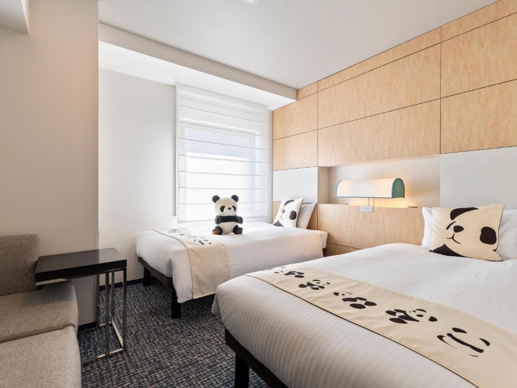 Postel nebo postele na pokoji v ubytování Mitsui Garden Hotel Ueno