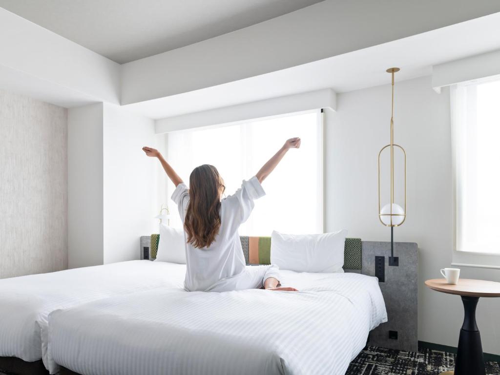 Postel nebo postele na pokoji v ubytování Mitsui Garden Hotel Ueno