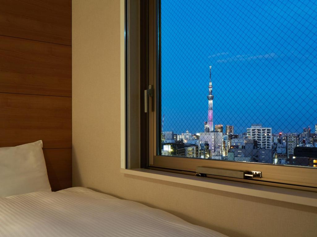 Postel nebo postele na pokoji v ubytování Mitsui Garden Hotel Ueno