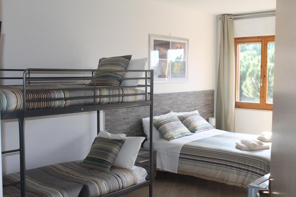 Posteľ alebo postele v izbe v ubytovaní "VACANZA A CASA" - Gallicano & Gallicano2
