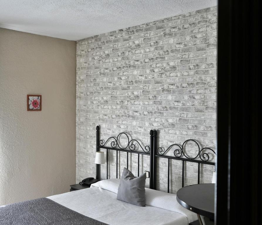 Posteľ alebo postele v izbe v ubytovaní Hostal Mainz