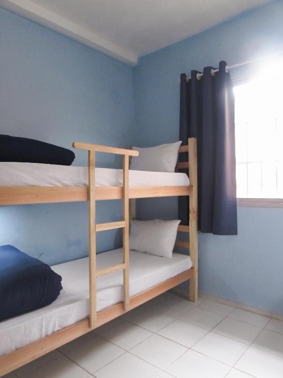 Postel nebo postele na pokoji v ubytování Hostel Kaizen Curitiba