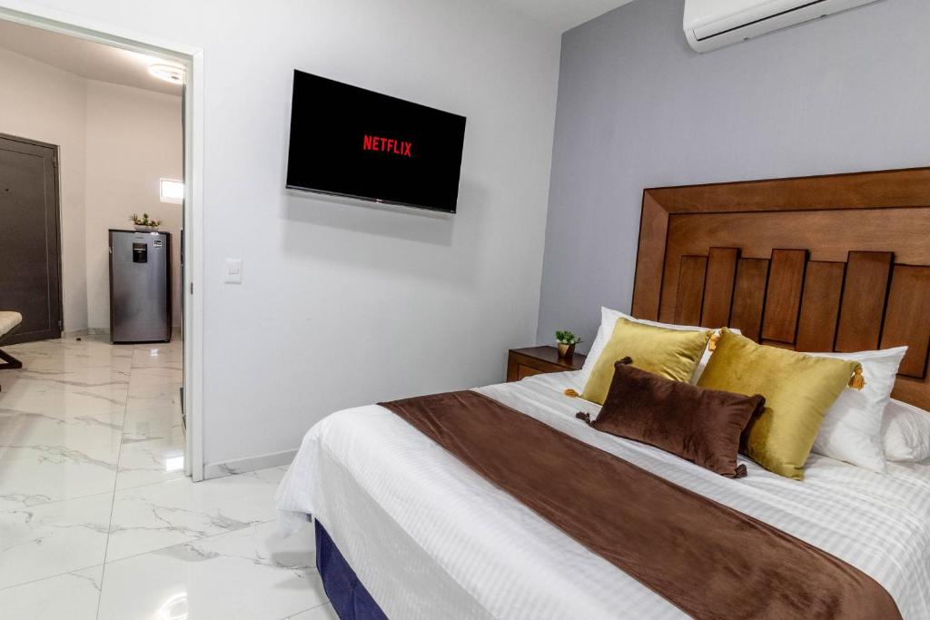 Postel nebo postele na pokoji v ubytování Exclusiva suite en el centro de Zapotlanejo 205