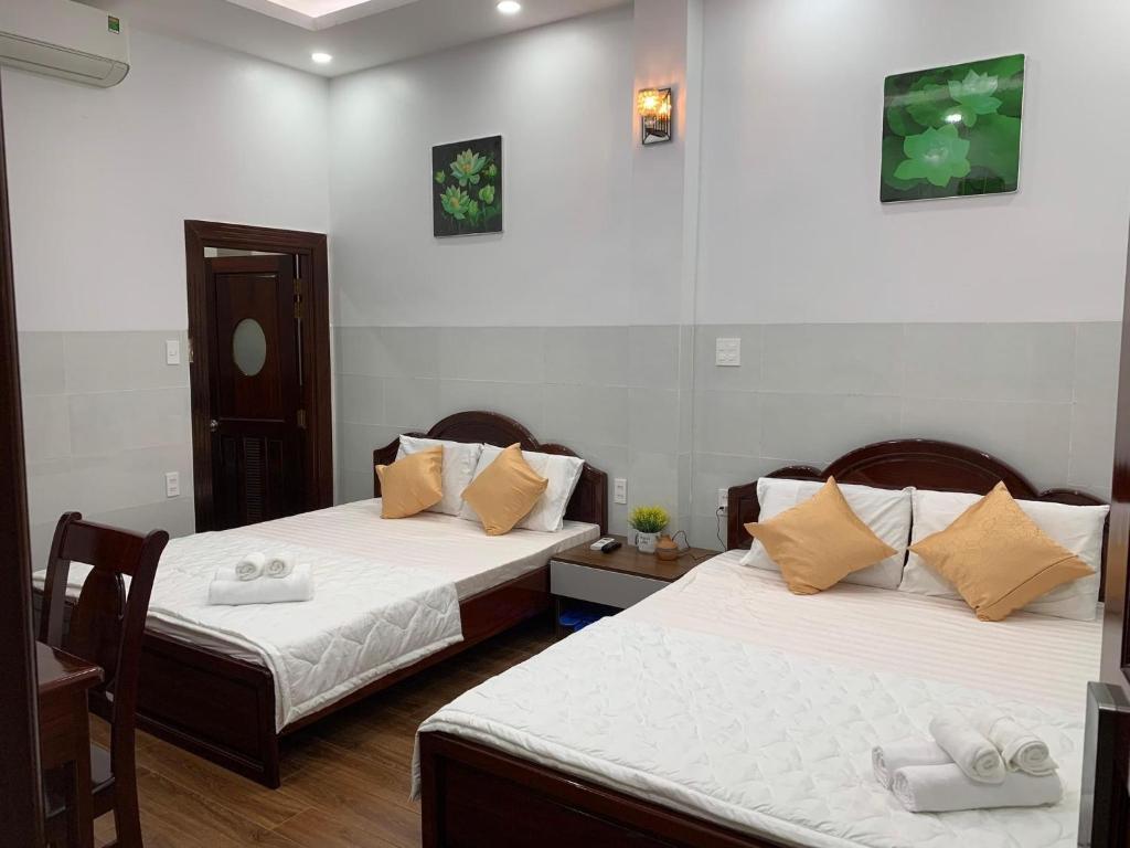Postel nebo postele na pokoji v ubytování Motel Mỹ Vân