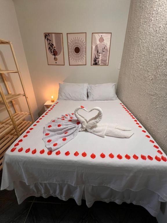 a bed with a heart made out of red polka dots at Martuno house in Fernando de Noronha