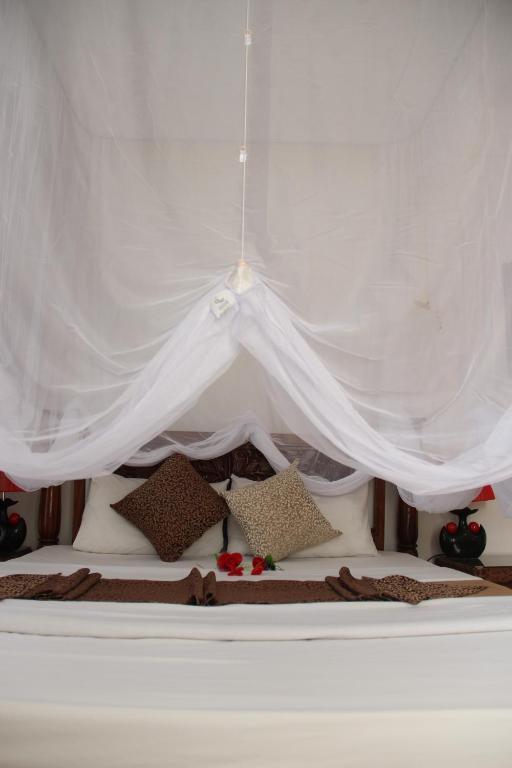 Letto o letti in una camera di Al-Minar Hotel