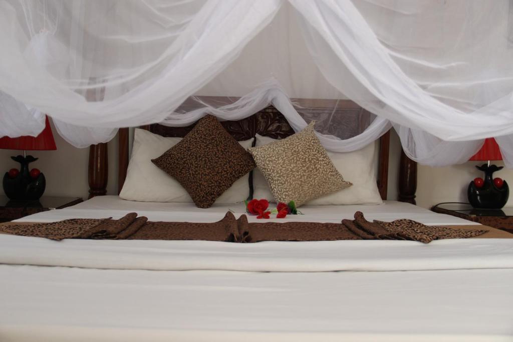 Letto o letti in una camera di Al-Minar Hotel