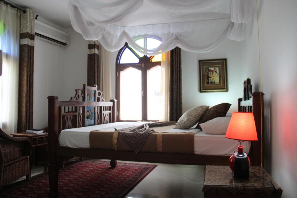 Letto o letti in una camera di Al-Minar Hotel