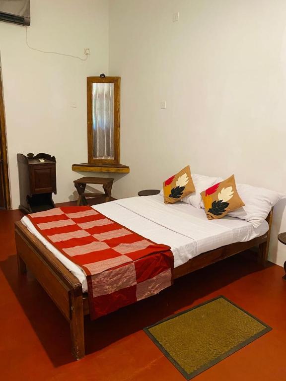 Postel nebo postele na pokoji v ubytování Kings Rest Sigiriya