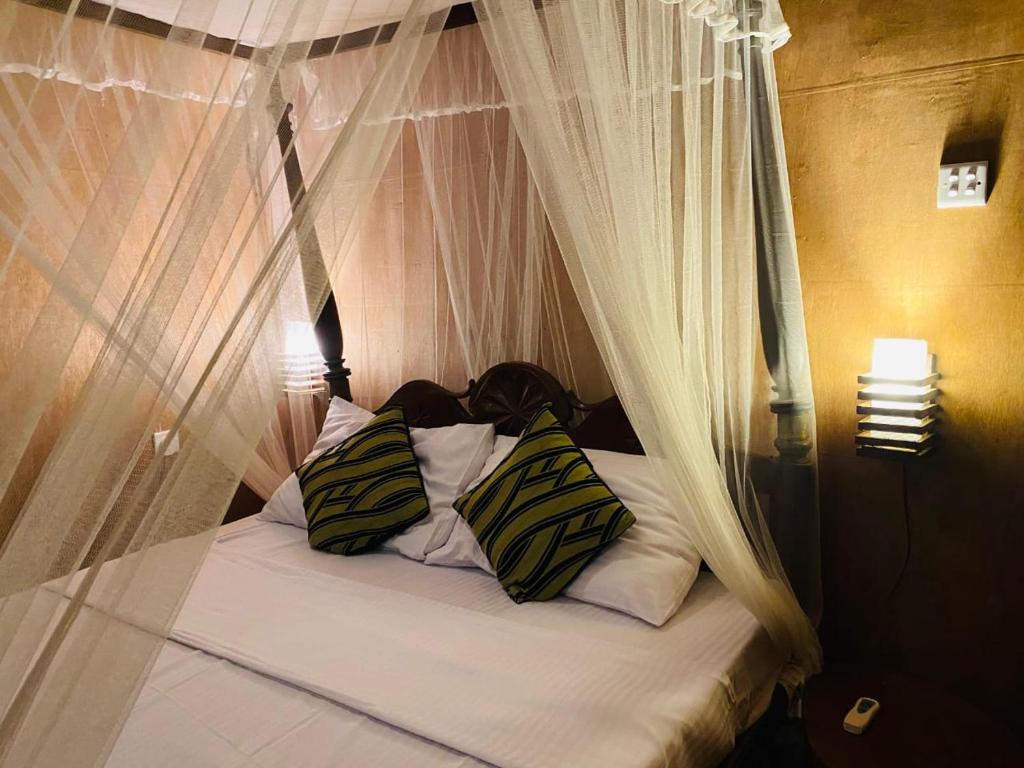 Postel nebo postele na pokoji v ubytování Kings Rest Sigiriya