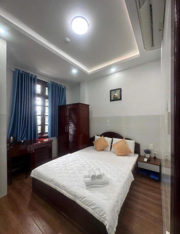 Postel nebo postele na pokoji v ubytování Motel Mỹ Vân
