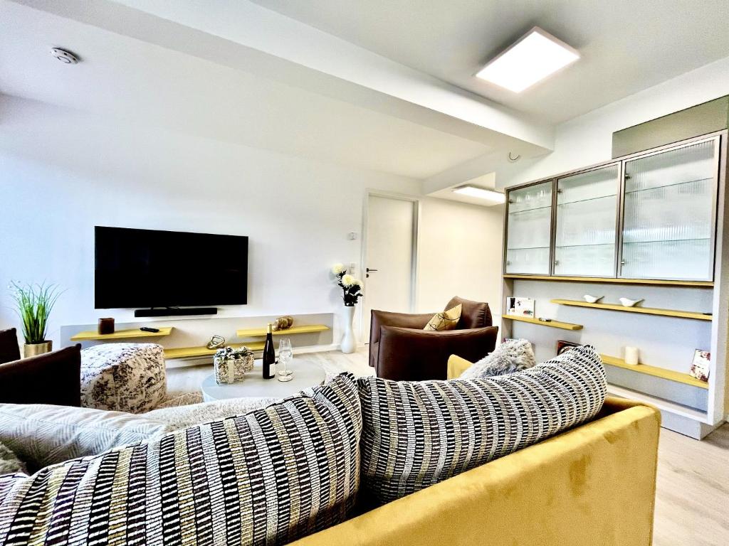 Et tv og/eller underholdning på Ferienwohnung Leuchtfeuer im Haus Zudar Prora