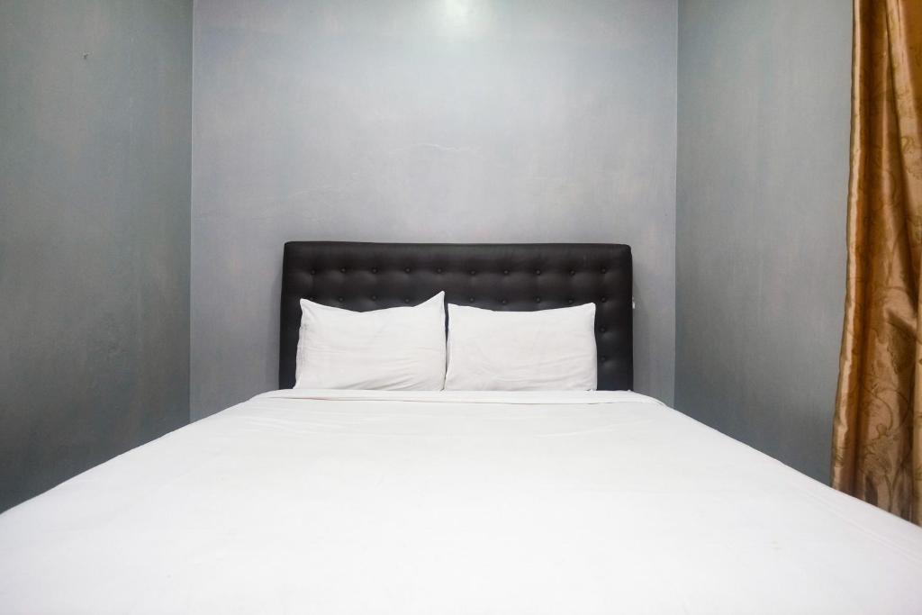 Postel nebo postele na pokoji v ubytování Al Abror Homestay Mandala Krida Mitra RedDoorz