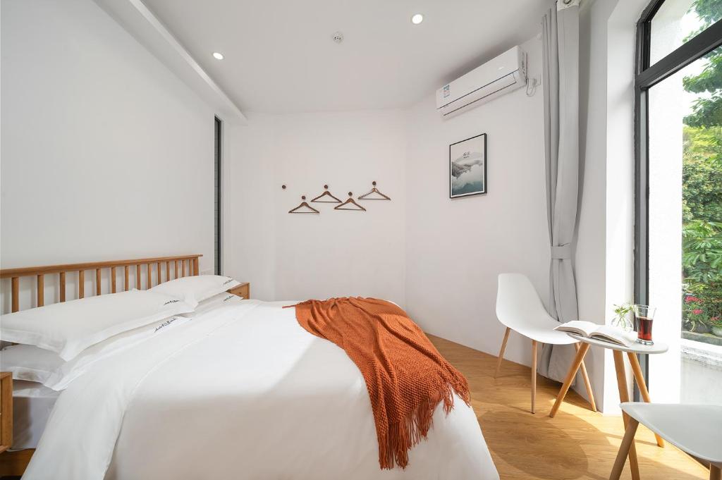 Gulangyu Sunlit Rock Garden Resort客房内的一张或多张床位