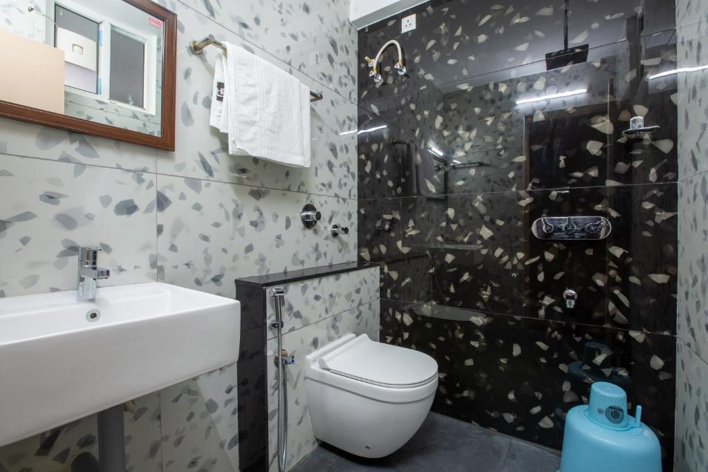 Koupelna v ubytování Hotel PRM Aruna Archadia