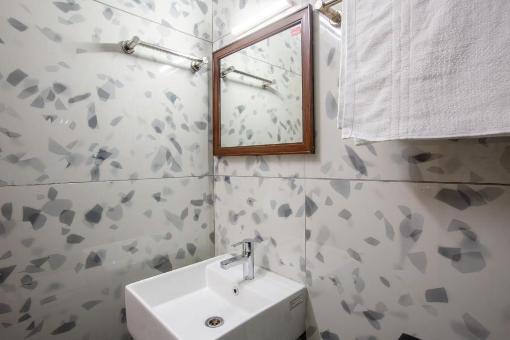 Koupelna v ubytování Hotel PRM Aruna Archadia