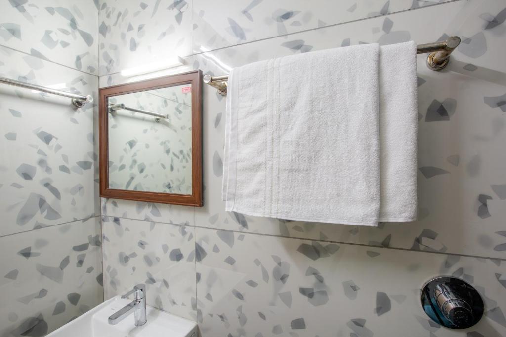 Koupelna v ubytování Hotel PRM Aruna Archadia