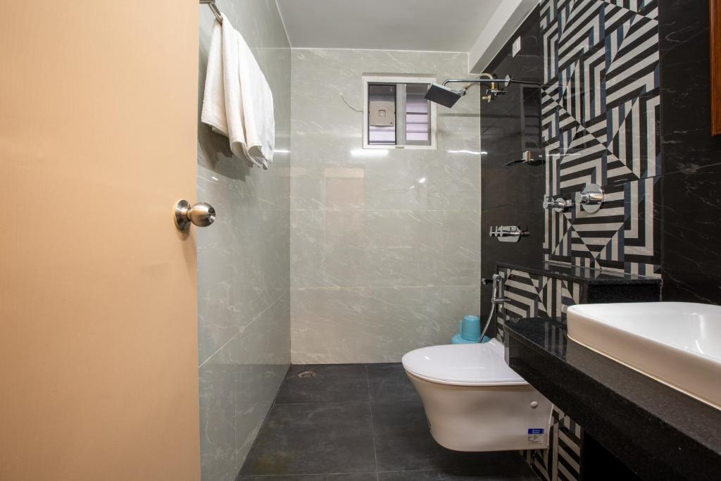 Koupelna v ubytování Hotel PRM Aruna Archadia