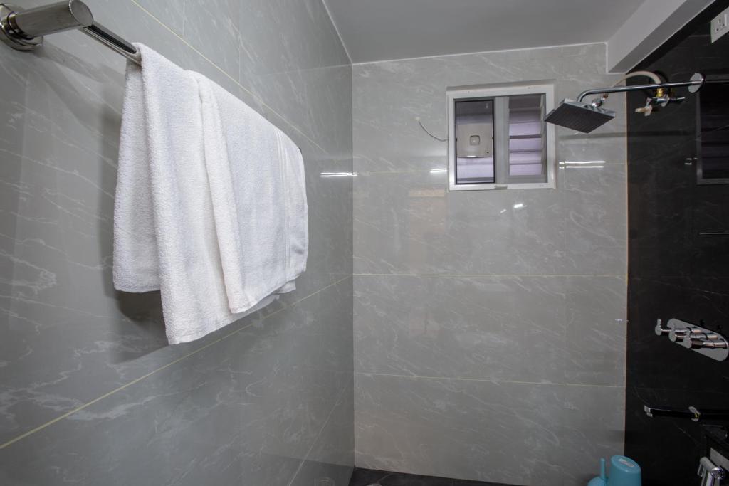 Koupelna v ubytování Hotel PRM Aruna Archadia