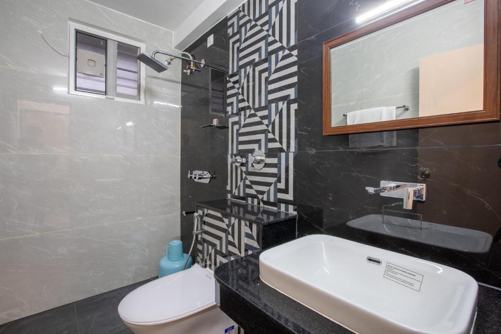Koupelna v ubytování Hotel PRM Aruna Archadia