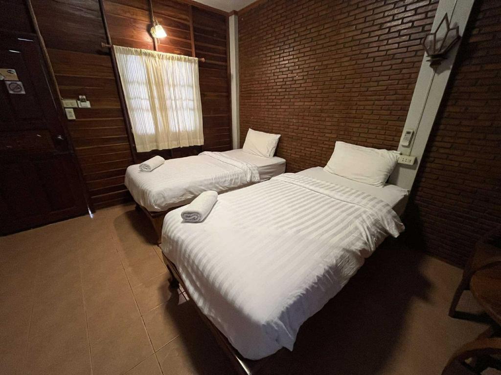 Postel nebo postele na pokoji v ubytování Old City Guest House