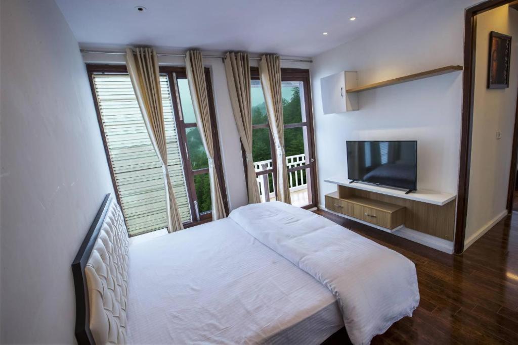 TV a/nebo společenská místnost v ubytování Holiday In Homestay