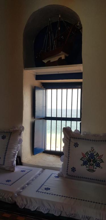 Postel nebo postele na pokoji v ubytování Tiwi Santorini