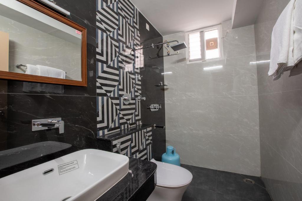 Koupelna v ubytování Hotel PRM Aruna Archadia