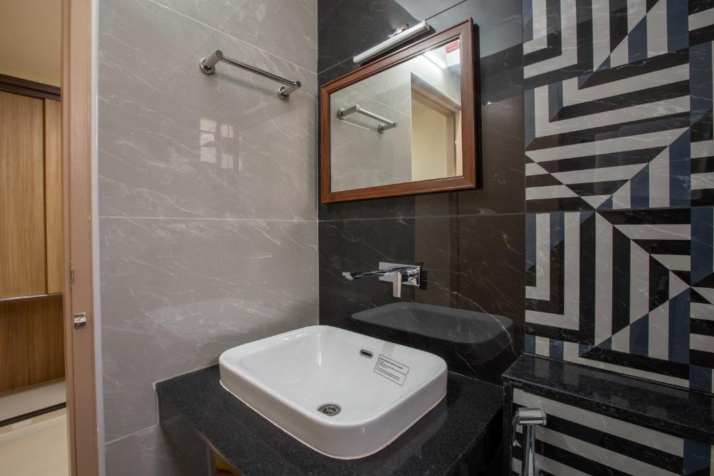 Koupelna v ubytování Hotel PRM Aruna Archadia