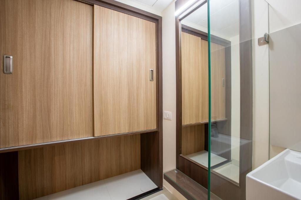 Postel nebo postele na pokoji v ubytování Hotel PRM Aruna Archadia