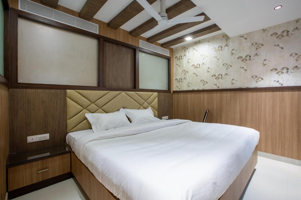 Postel nebo postele na pokoji v ubytování Hotel PRM Aruna Archadia