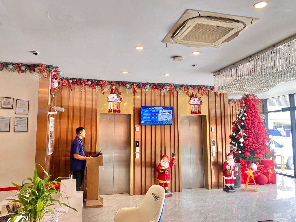 TV a/nebo společenská místnost v ubytování 广东大酒店Guangdon Business Hotel-SM Mall of Asia, SMX & Manila World Trade Center