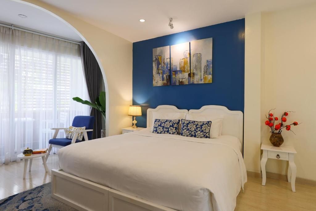 Postel nebo postele na pokoji v ubytování Chez Mimosa Corner