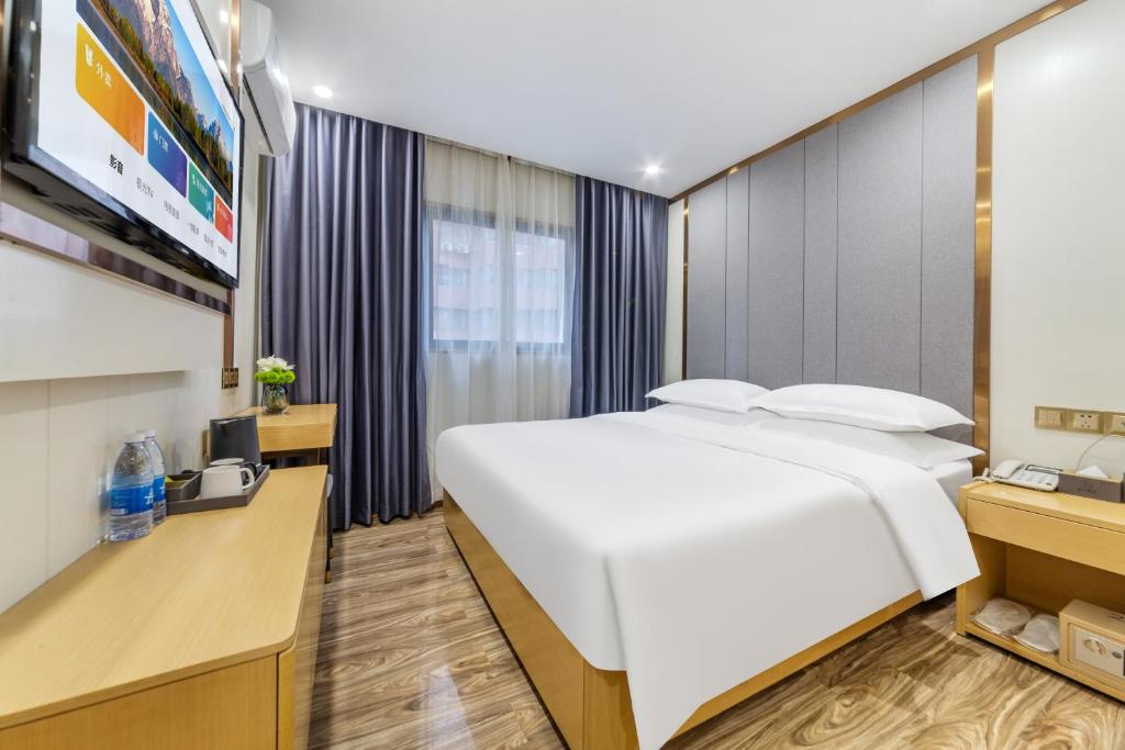 Postel nebo postele na pokoji v ubytování 泊汀酒店广州北京路步行街省中医店