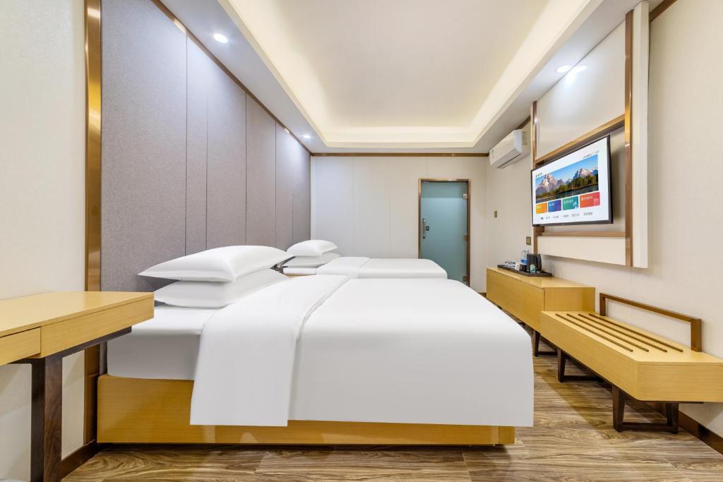 Postel nebo postele na pokoji v ubytování 泊汀酒店广州北京路步行街省中医店