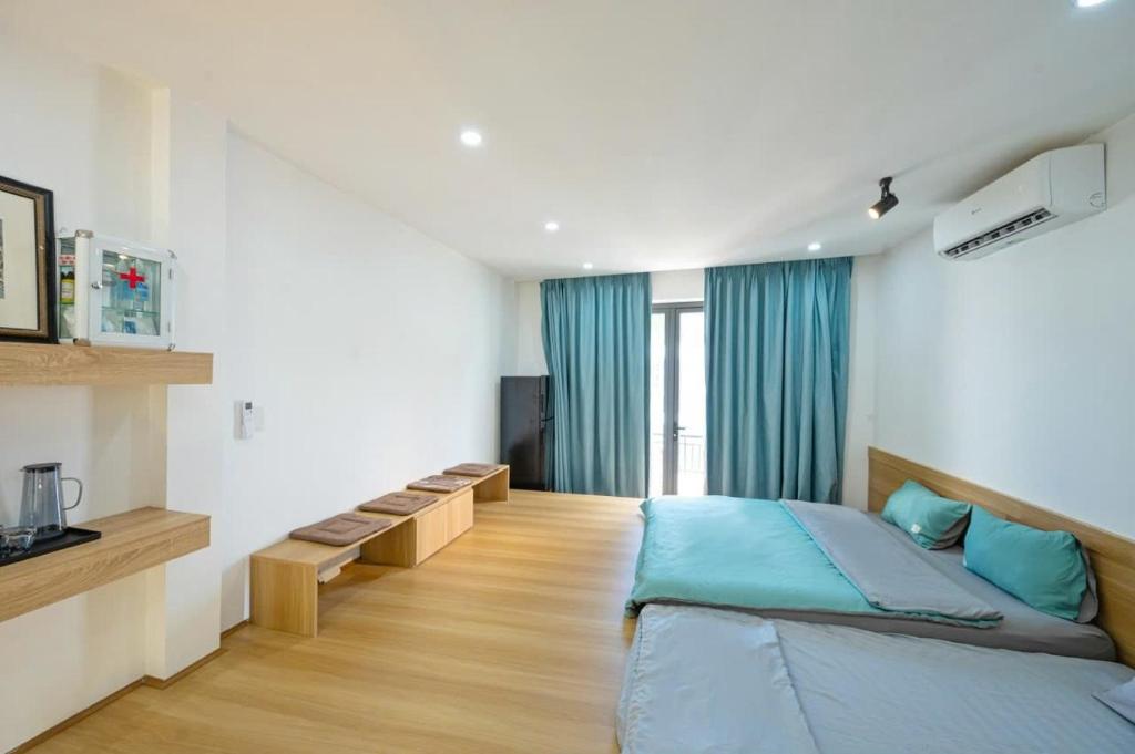 Postel nebo postele na pokoji v ubytování Q Hotel & Apartment Da Nang