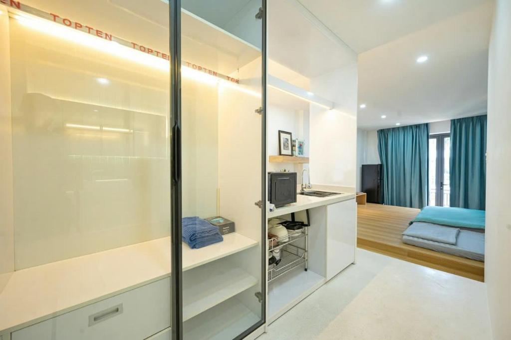 Postel nebo postele na pokoji v ubytování Q Hotel & Apartment Da Nang