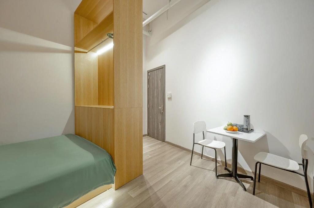 Postel nebo postele na pokoji v ubytování Q Hotel & Apartment Da Nang