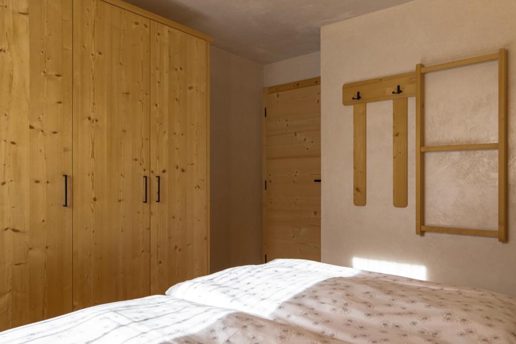 Posteľ alebo postele v izbe v ubytovaní Ciasa Iachin - Dolomites Dream Retreat