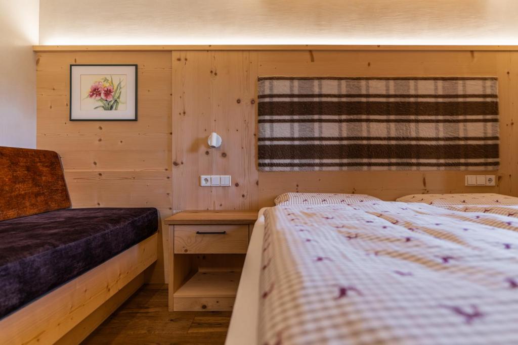 Posteľ alebo postele v izbe v ubytovaní Ciasa Iachin - Dolomites Dream Retreat
